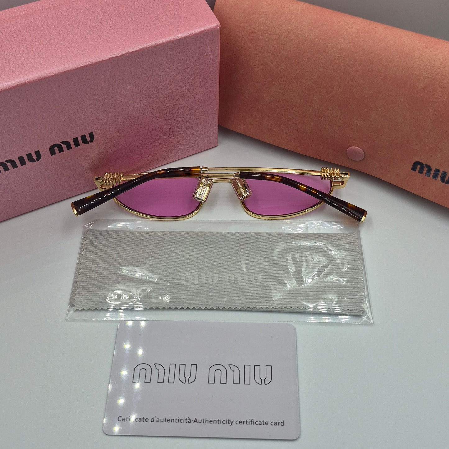 Solaires: MIUMIU SMU52S doré rose