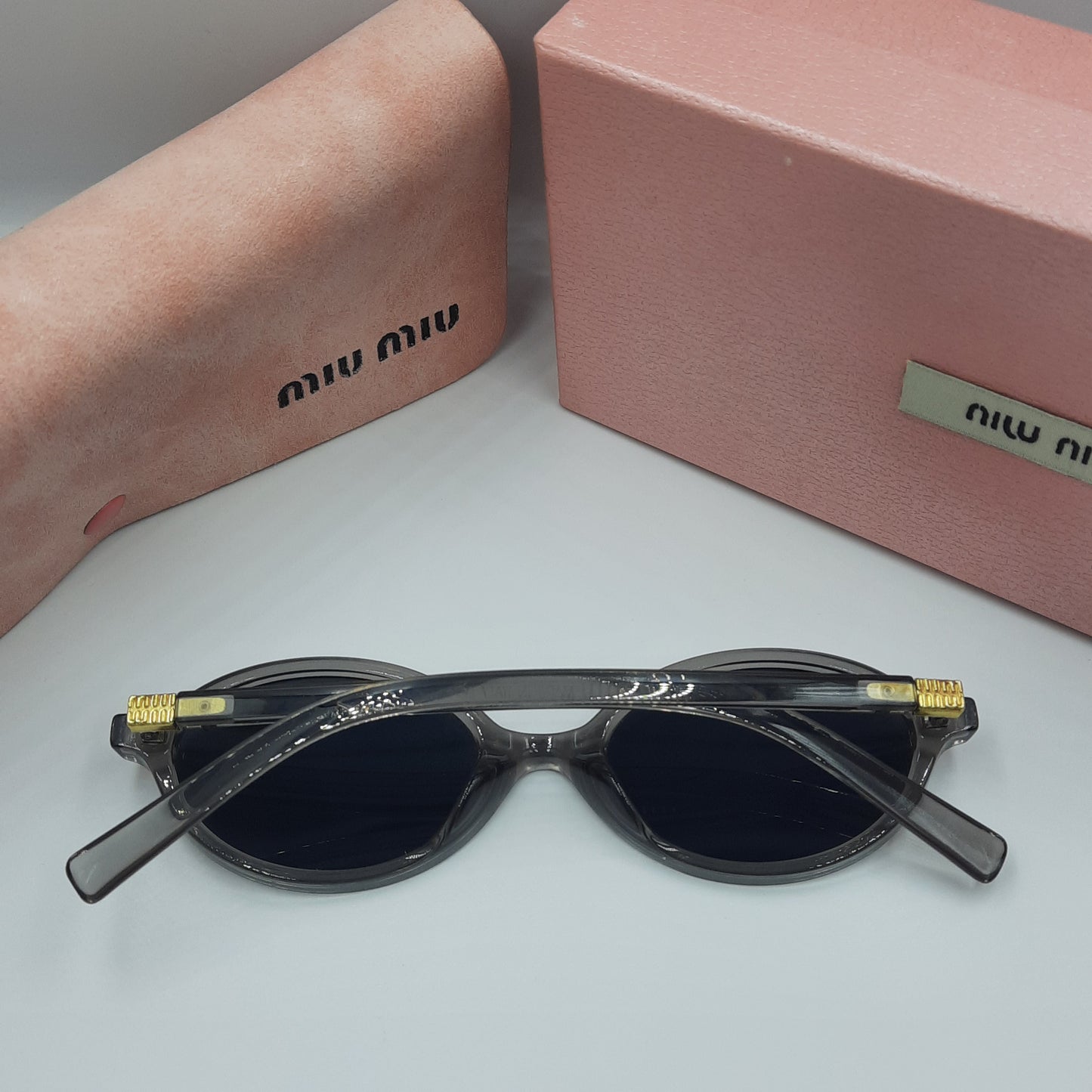 Solaires: MIUMIU doré gris