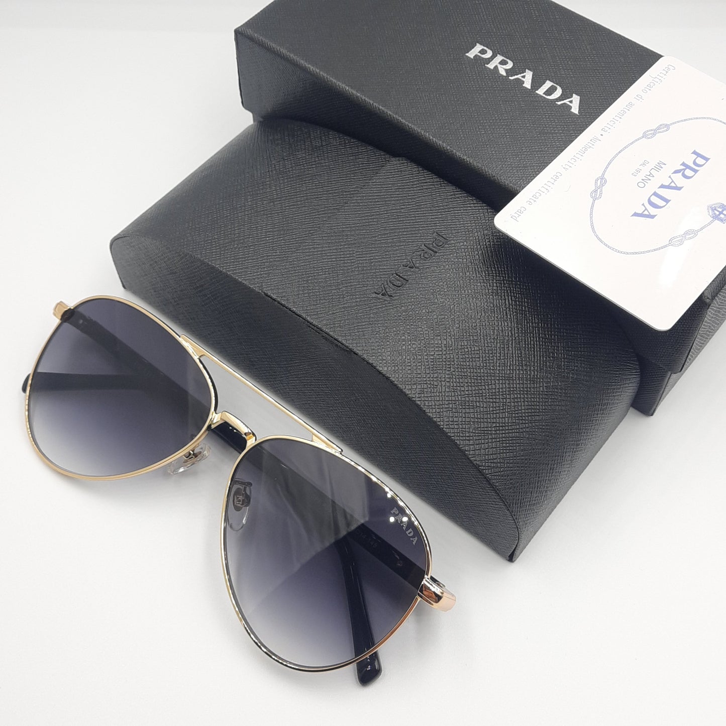 Solaires: PRADA SPRA58 doré noir deg