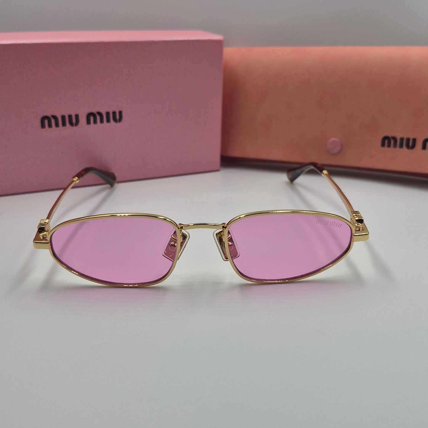 Solaires: MIUMIU SMU52S doré rose