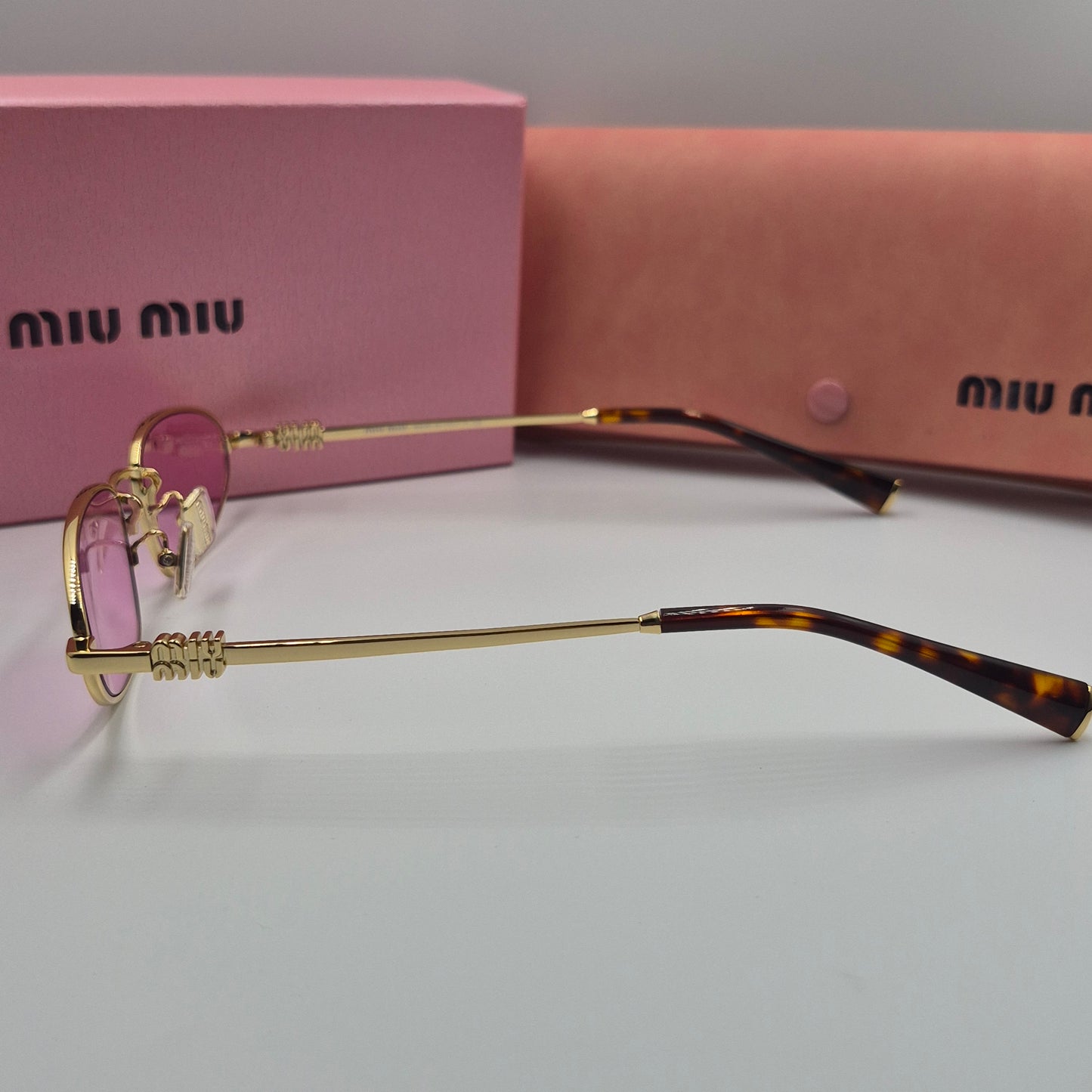 Solaires: MIUMIU SMU52S doré rose