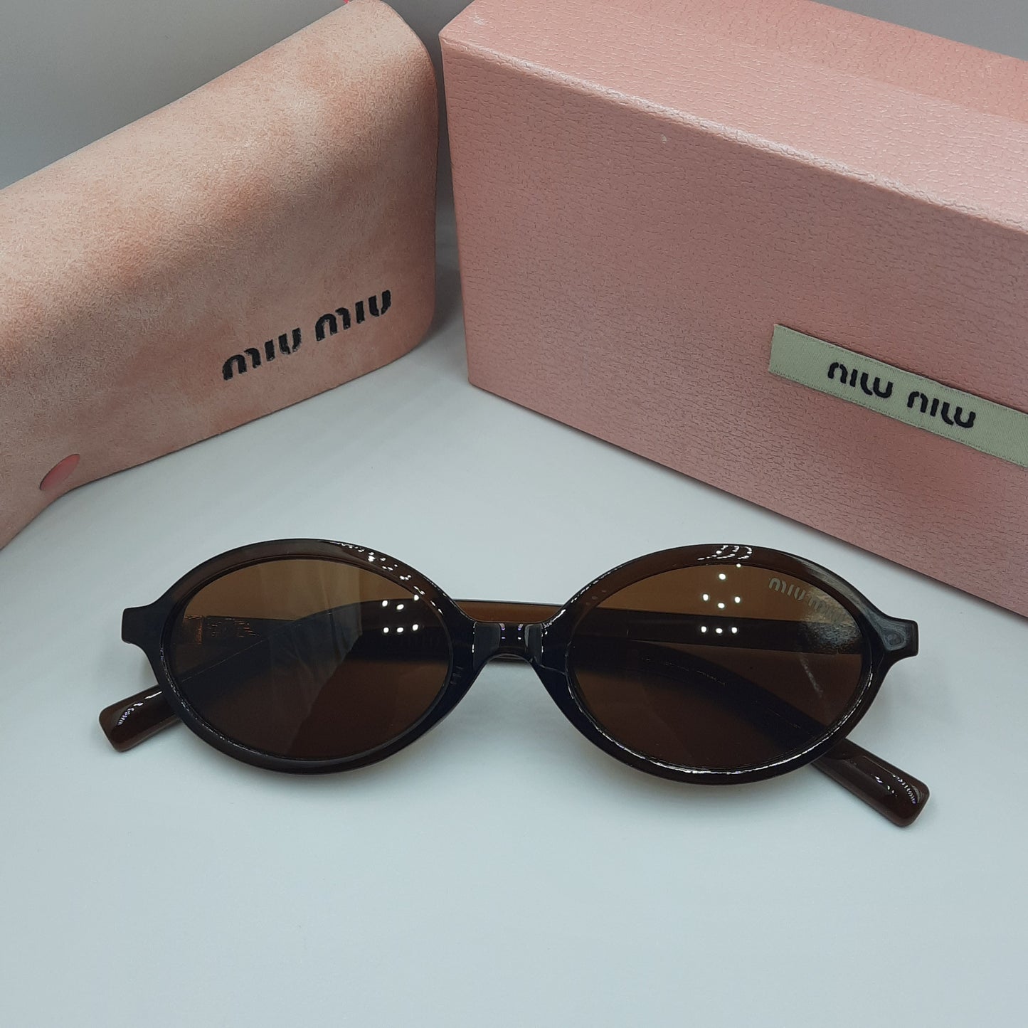 Solaires: MIUMIU doré marron