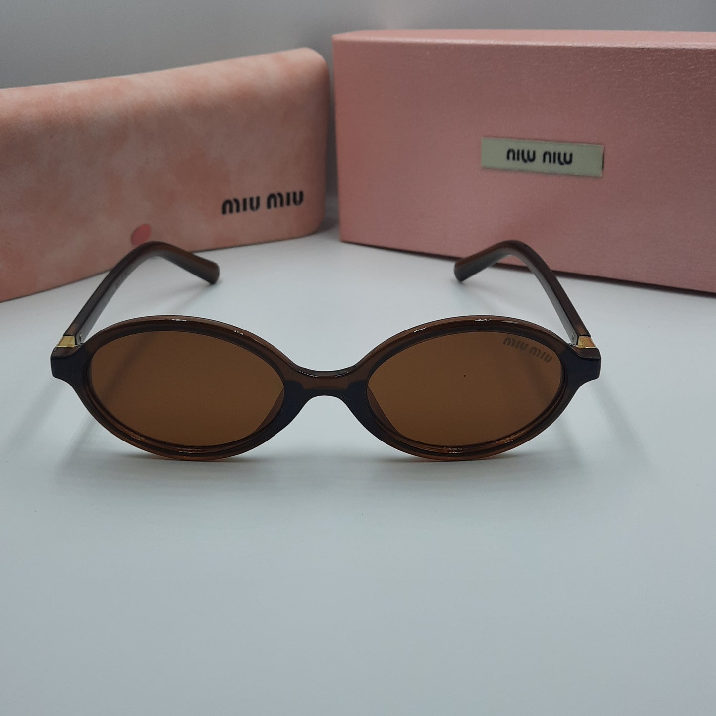 Solaires: MIUMIU doré marron