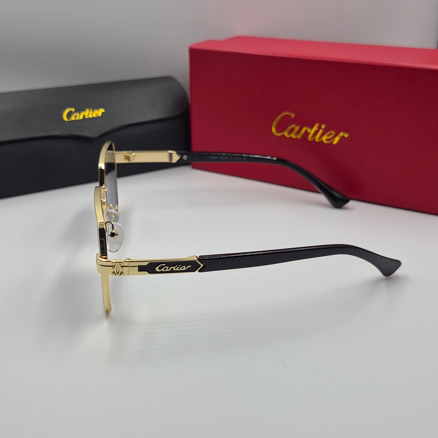 Solaires: CARTIER doré noir
