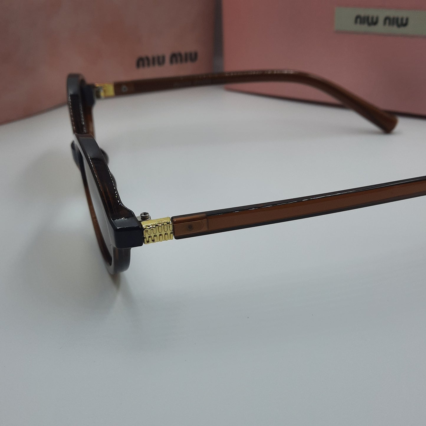 Solaires: MIUMIU doré marron