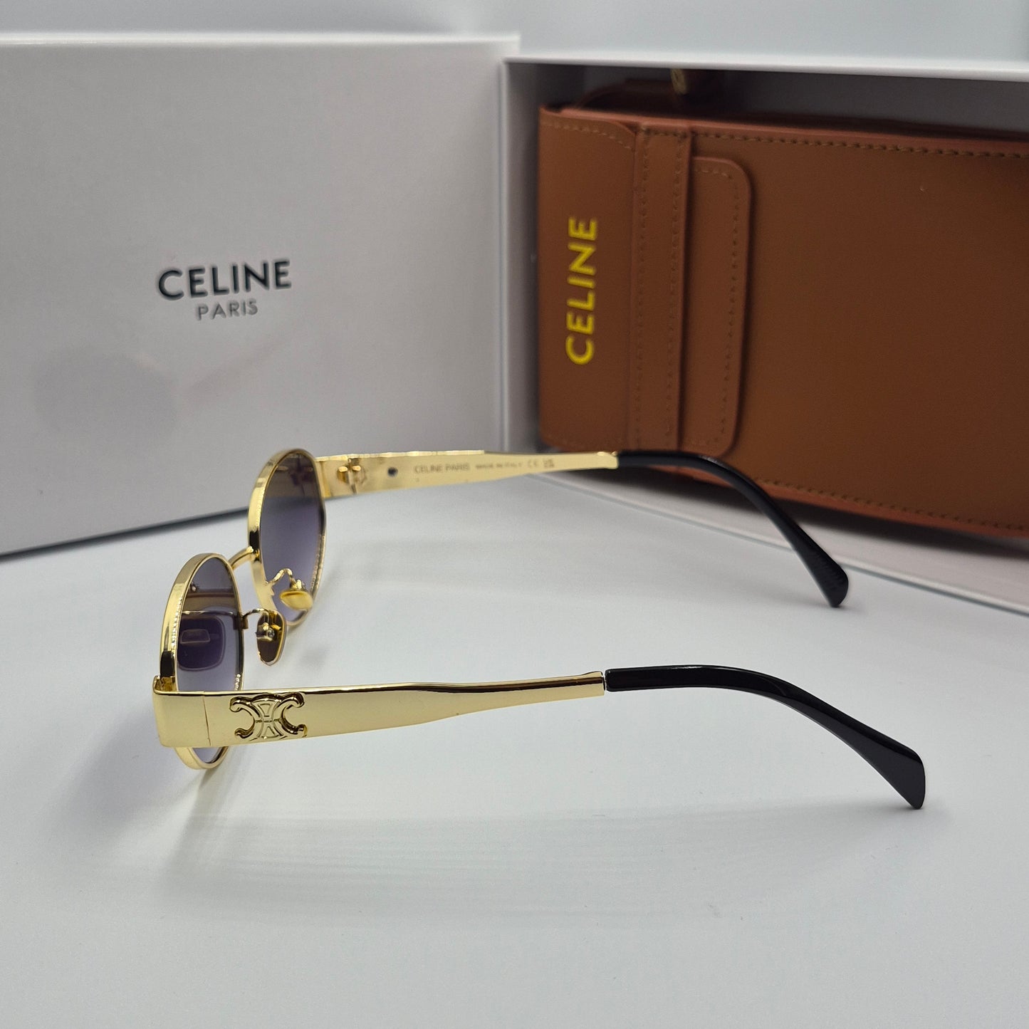 Solaires: CELINE Triomphe doré noir deg avec pochette à bandoulière